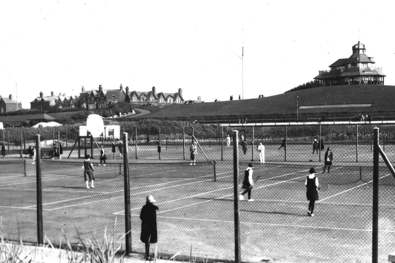 In this photo, The Mount forms a backdrop to tennis courts where the Marine Gardens are now. It was take taken in the 1920s
