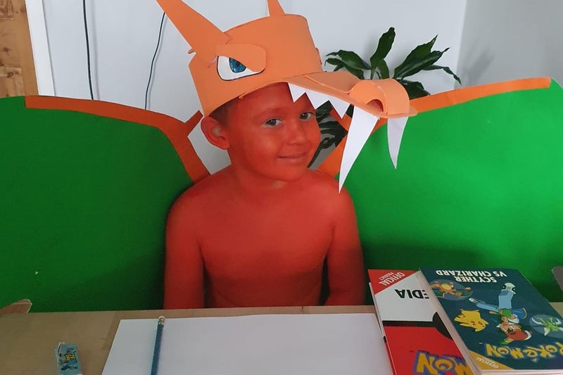 George Sambrook, six, as Charizard Pokemon