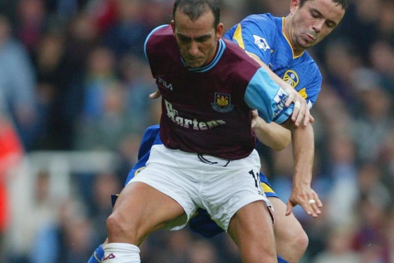 Gary Kelly battles with West Ham United's Paolo Di Canio.
