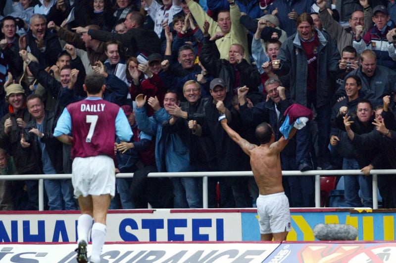 Paulo Di Canio celebrates after pouncing on a spill by Paul Robinson to equalise for the Hammers.
