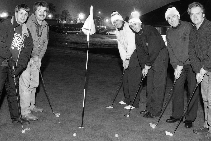 Competitors in a night golf competition for charity at Standish Court Golf Club in May 1995. Fluorescent golf balls were used to trace their flight.