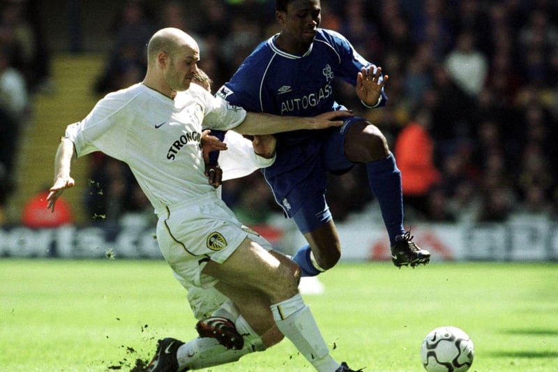 Danny Mills tussles with Chelsea's Celestine Babayaro.
