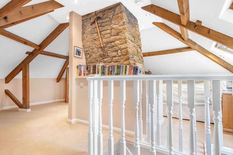The characterful first floor room includes storage