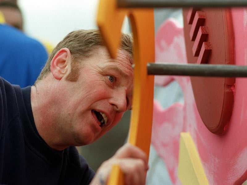 Artist Kevin Harrison puts the finishing touches to the sculpture.