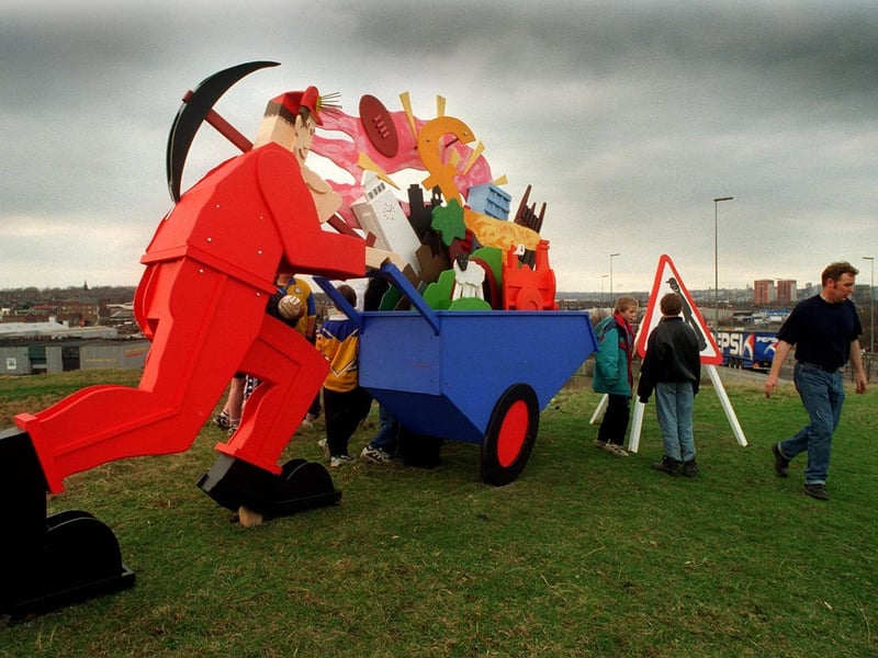 The sculpture takes up its position at the top of a grassed slag heap.