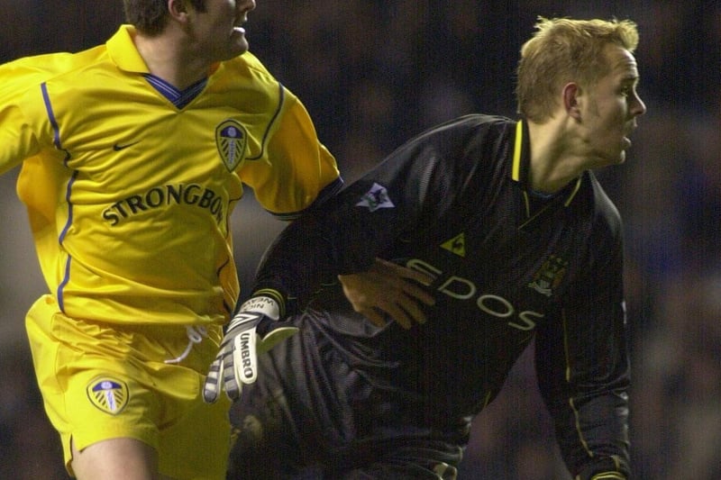 Robbie Keane gets the better of Manchester City goalkeeper Nicky Weaver to score during the Premiership clash at Maine Road in January 2001. He bagged a brace as Leeds won 4-0.