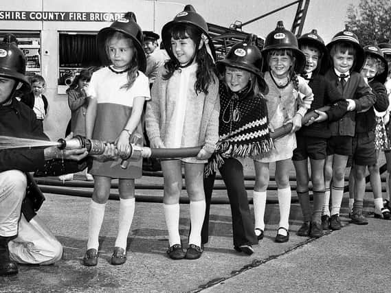 Primary school pupils enjoy a trip to Hindley Green Fire Station in 1971.