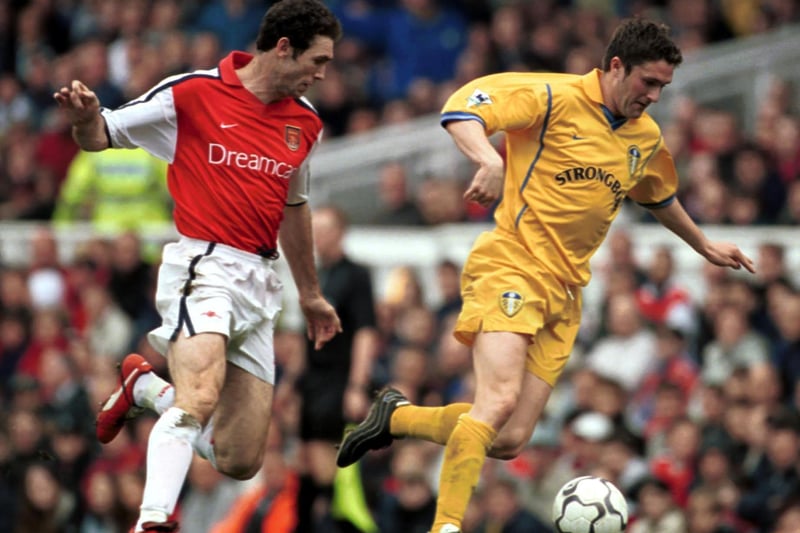 Robbie Keane of Leeds gets away from Arsenal's Martin Keown during the FA Carling Premiership at Highbury in May 2001.