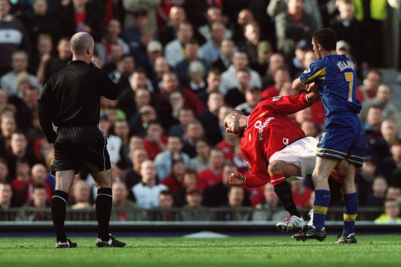 Manchester United's David Beckham is pushed to the ground by Robbie Keane during the Premiership clash at Old Trafford in October 2001.