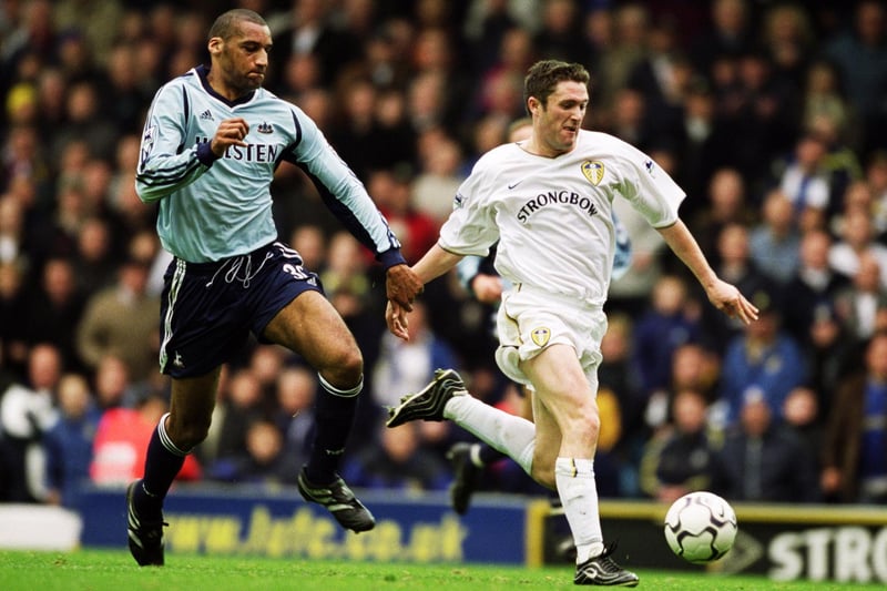 Robbie Keane is closely followed by Tottenham Hotspur's Dean Richards during the Premiership clash at Elland Road in November 2001. Leeds won 2-1.
