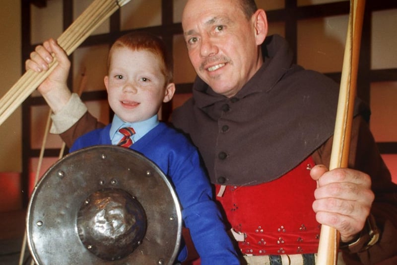 Five-year-old Mark Wilkinson from Moortown is pictured with Frank Hammond dressed as an Agincourt archer.