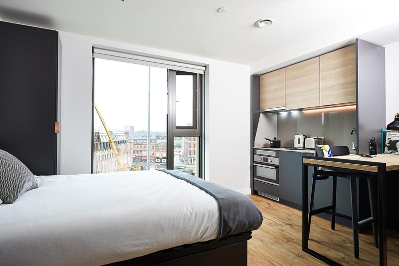 This studio flat is a light and spacious space for eating, sleeping and working in. There's plenty of storage space in cupboards and it boasts a pretty good view of the city. 

(photo: Vita student)
