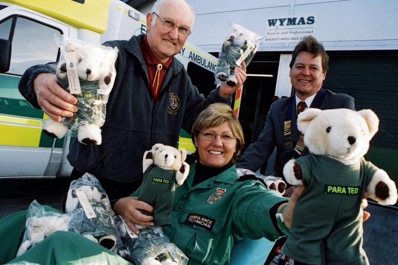 Garforth Lions Geoffrey Smith (left) and David Hill present 100 Para Teds to Beryl Holmes, ambulance technician at Seacroft ambulance station.