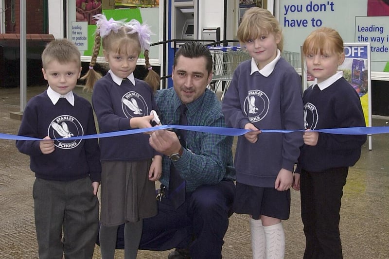 Children from Stanley Infant School open the new Co-op convenience shop on Preston Old Road in Blackpool. Pictured from left to tright are Craig Pennington, Jemma Ainsworth, manager Darren Hedley, Jemma Jones and Mikaela Bell