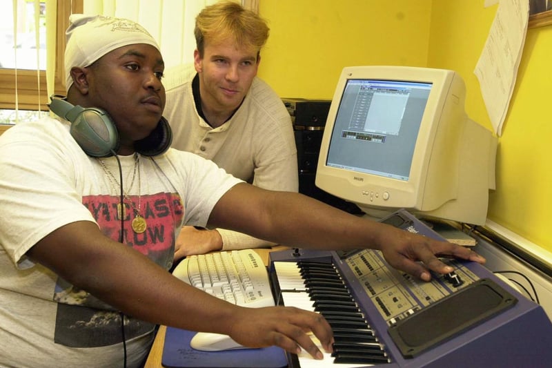 Jonathan Dore (right), a young people's advice worker at Archway in Harehills shows DJ Jacoby Farrell how to put tracks together.