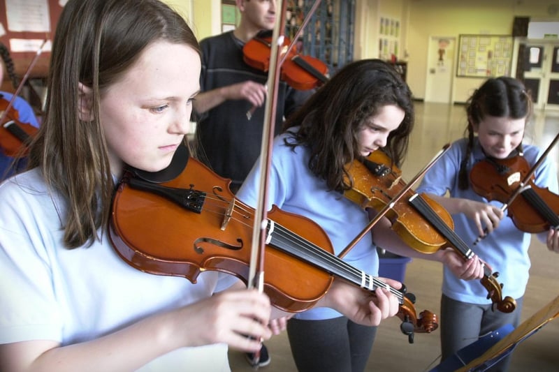 Youngsters from St Josephs RC School play violins with the help from the Harehills Irish Music Project which received a grant from the Lloyds TSB Foundation.