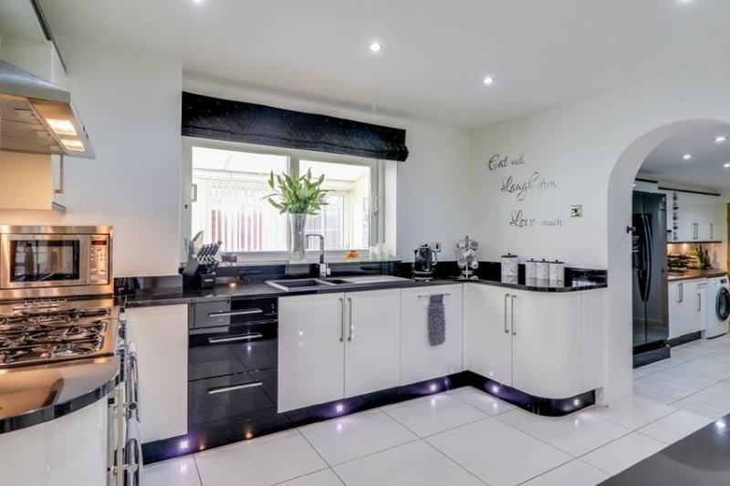 The kitchen has a range of units to high and low level with granite work surfaces and an inset 1 1/2 bowl Asterite sink and drainer with mixer tap, space for Range cooker (gas or electric) with stainless steel splashback and stainless steel extractor filter hood.