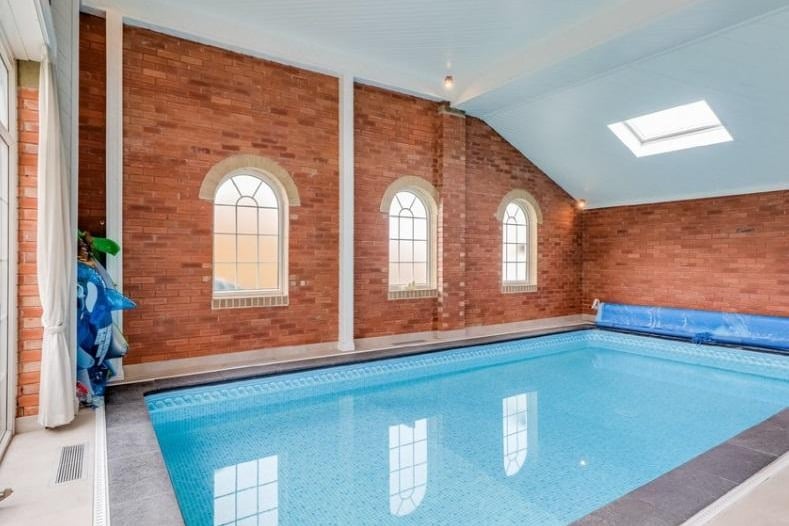 Swimming pool, stairs leading to the first floor games room, seating area, wall lighting and feature lighting. Access into the downstairs shower room/w.c.