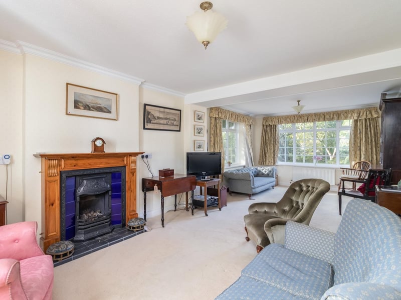 A traditional fireplace enhance the homely feel of the living room
