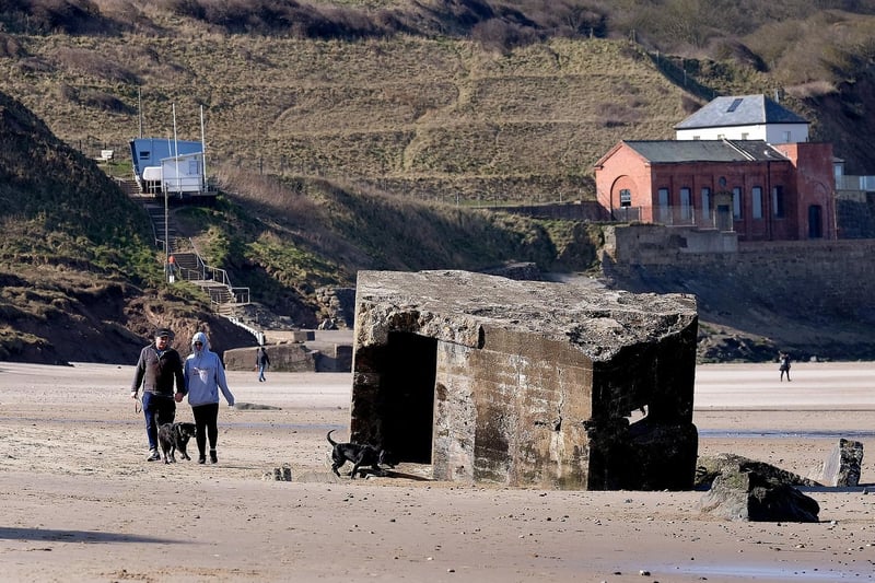 The concrete World War two defence stations strewn on the beach at Cayton Bay.