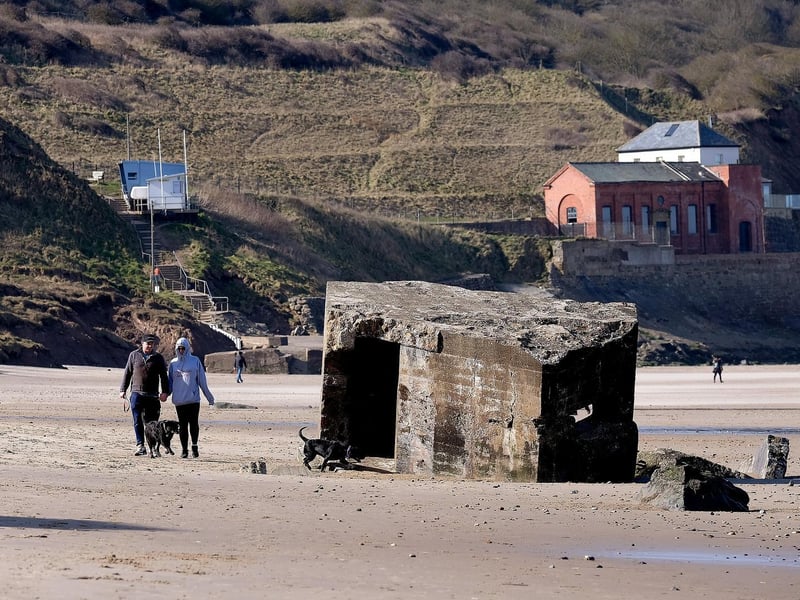 The concrete World War two defence stations strewn on the beach at Cayton Bay.