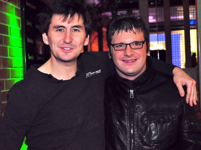 Roman, who was often behind the camera, and Chris, in 2010.