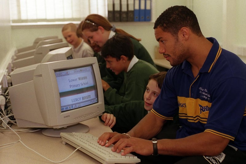 Leeds Rhinos star Leroy Rivett swapped his training kit for a computer keyboard when he opened the new comptuer suite at Lower Wortley Primary in June 1999. He is pictured with Nicholas Woodcock, one of the school's sports captains.