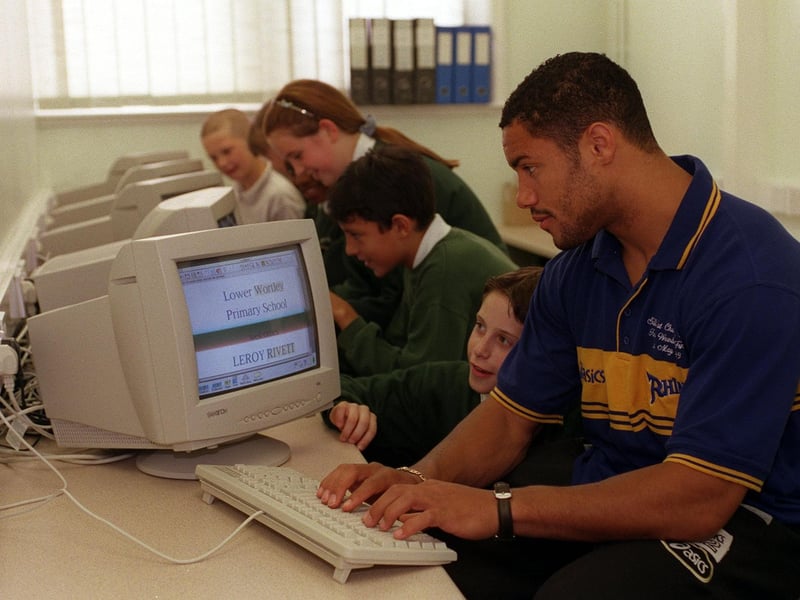 Leeds Rhinos star Leroy Rivett swapped his training kit for a computer keyboard when he opened the new comptuer suite at Lower Wortley Primary in June 1999. He is pictured with Nicholas Woodcock, one of the school's sports captains.
