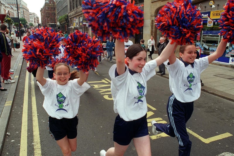 Members of Armley's Katzelite Cheerleaders put their best foot forward at the Leeds Marathon Fun Run in May 1999.