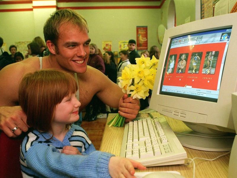 Abigail Barratt arrived at Harehills Library with a bunch of daffodils for Gladiator Hunter who launched the new Internet site at the library. The pair are pictured looking at the Gladiators web page.