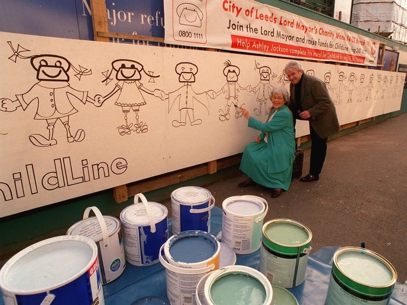 Artist Ashley Jackson and the Lord Mayor of Leeds Coun Linda Middleton with a 30ft mural to raise funds for Childline outside the Debenham's store on Briggate.