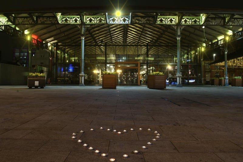 A heart of candles outside Preston Market