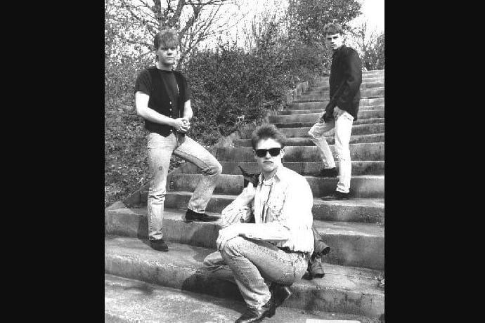Local pop group Dream Cycle stood on some steps