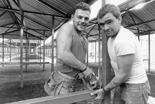 Dean Conway and Pete Jackson building new market stalls in Castleford