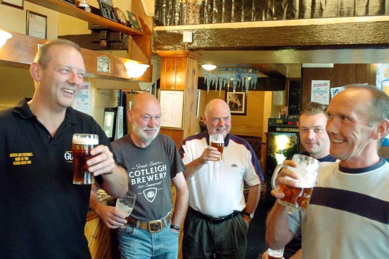 Landlord Neil Weaver, left, drinking with some of his regulars at the Robin Hood pub at Pontefract, where the Pontefract Beer Festival was held in 2004.