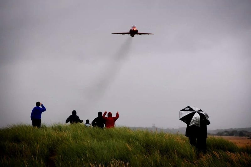Hardy spectators watch the Red Arrows take off at Blackpool Airport from the sand dunes at Squires Gate in 2014