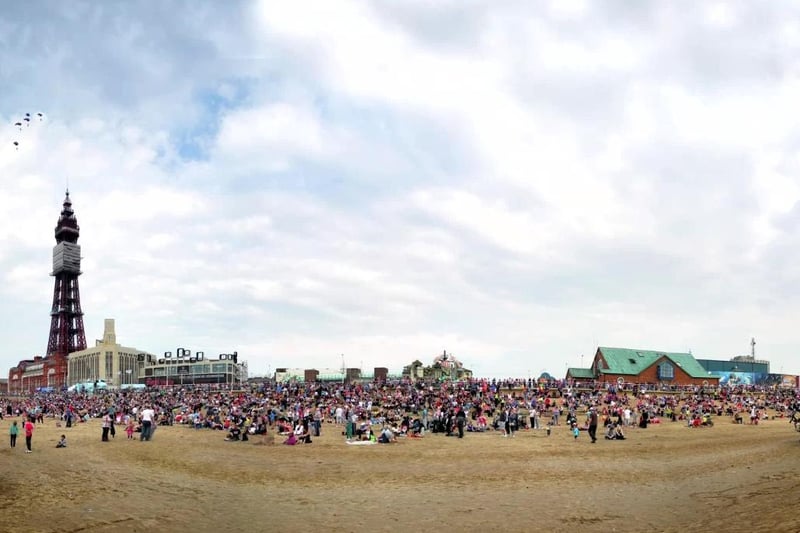 The RAF Falcon parachute team fly past the tower and the seafront crowds in 2012