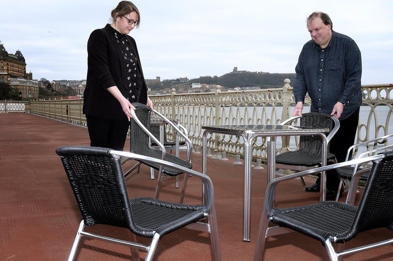 Senior supervisor Jess O'Neill with front of house food and beverages manager Chris Thompson arranging chairs on the Spa Terrace
