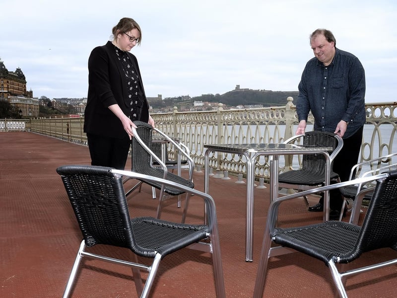 Senior supervisor Jess O'Neill with front of house food and beverages manager Chris Thompson arranging chairs on the Spa Terrace