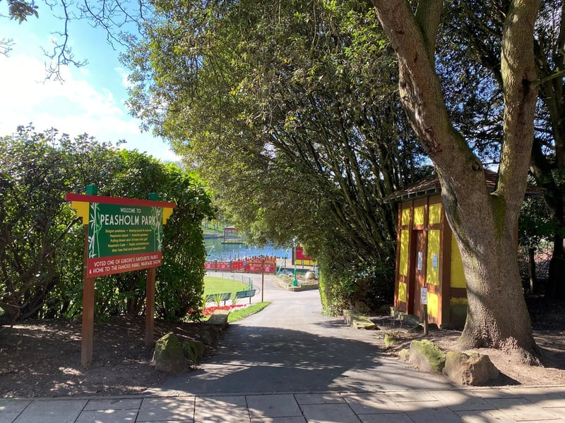 The archway no longer remains, and the putting green can now be seen next to the boathouse.