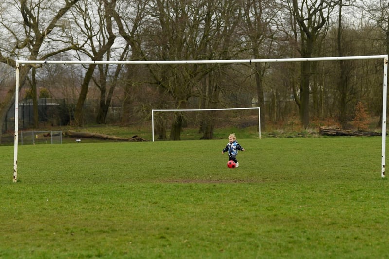 A young footballer gets ready for pitches to reopen