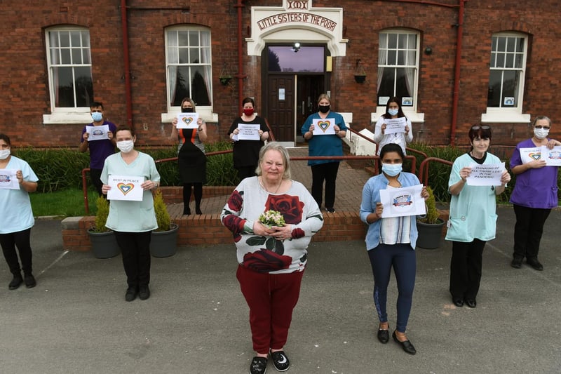 Staff and residents at Springfield Manor Gardens mark the first anniversary of lockdown