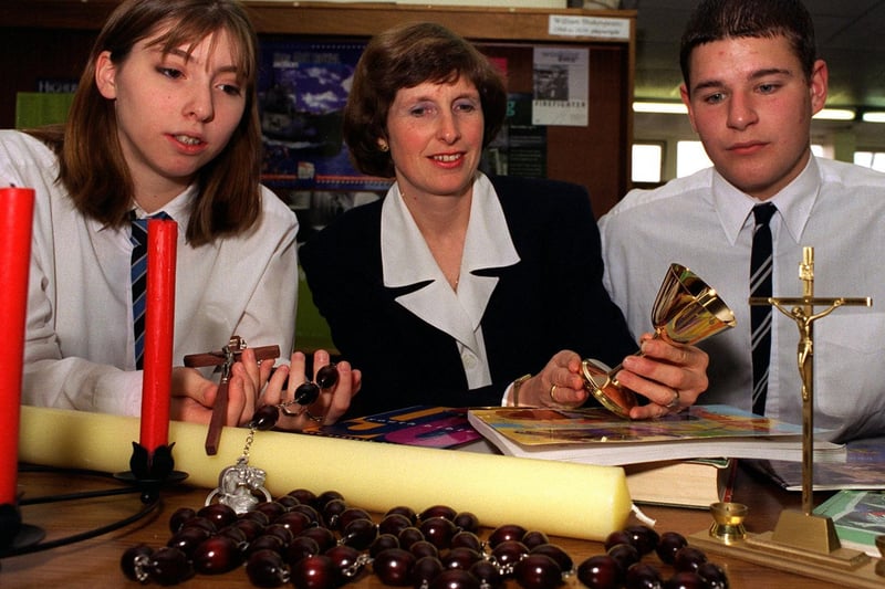 October 1996 and Carol Heatley, head of RE at Prince Henry's Grammar is pictured with pupils Helen Spencer and Robert Lyon and religious artifacts used in lessons.