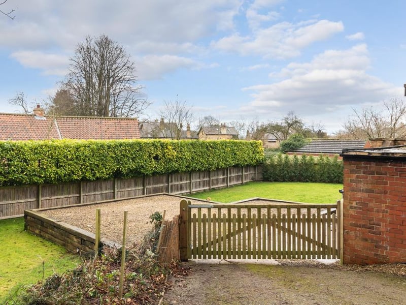 The house sits in easy to maintain gardens