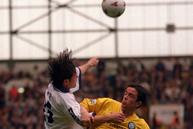 Tottenham Hotspur's Stephen Carr tangles with Gary Kelly.