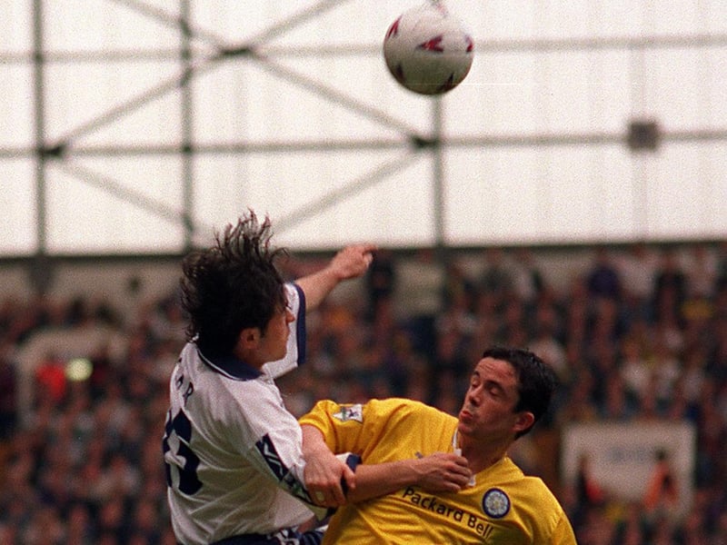 Tottenham Hotspur's Stephen Carr tangles with Gary Kelly.