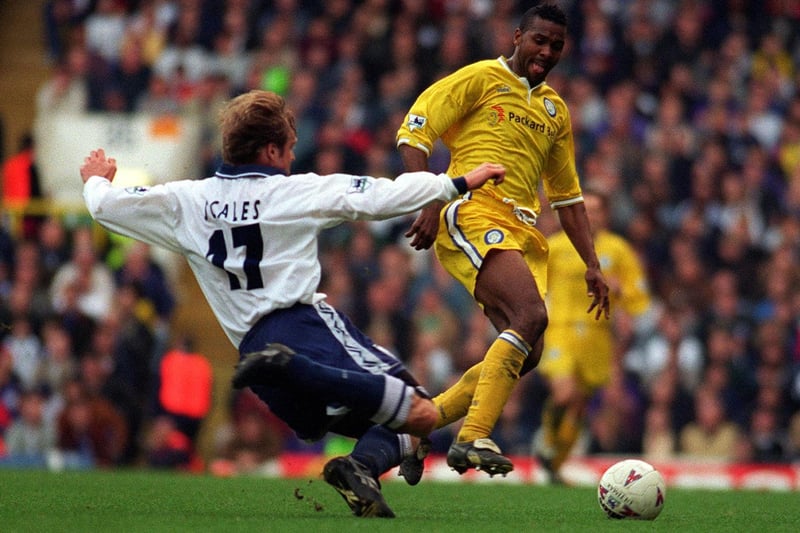 Tottenham Hotspur's John Scales slides in to tackle Lucas Radebe.