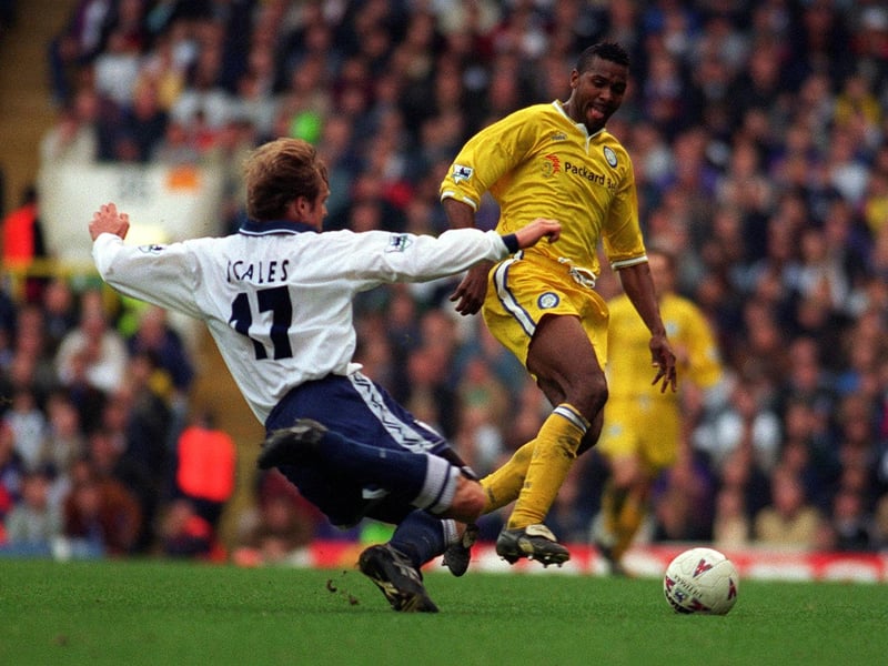 Tottenham Hotspur's John Scales slides in to tackle Lucas Radebe.