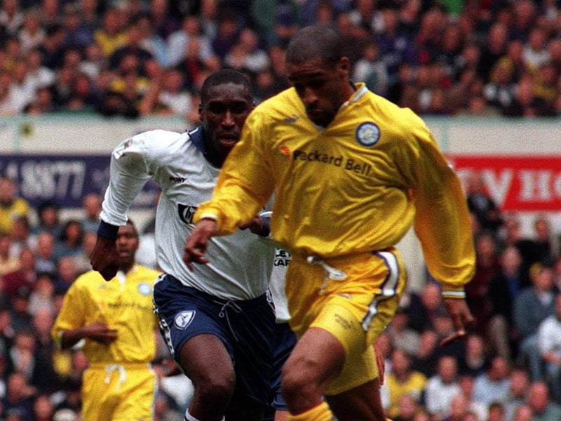 Brian Deane pushes forward with Tottenham Hotspur's Sol Campbell in pursuit.