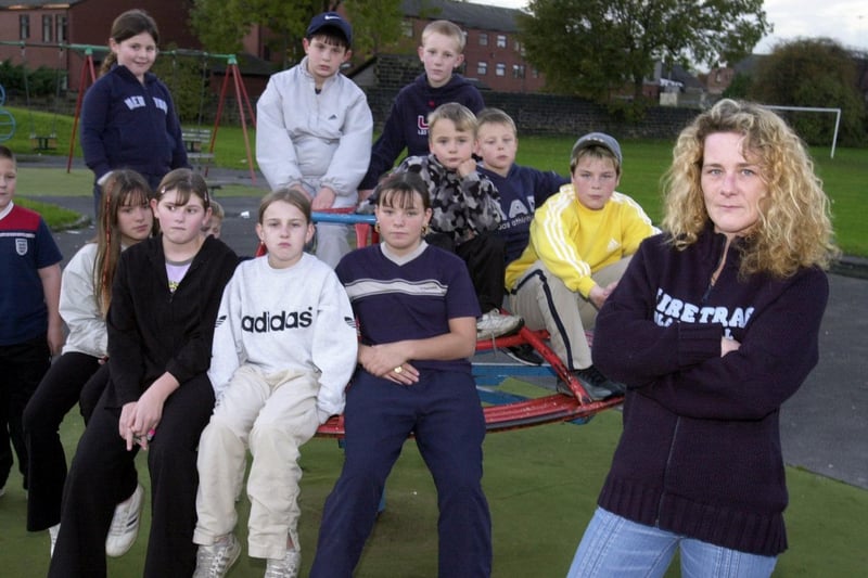November 2002 and there was calls to clean-up Hunslet Moor Park which was strewn with glass and rubbish. Pictured is campaigner Helen Kelly with local youngsters.